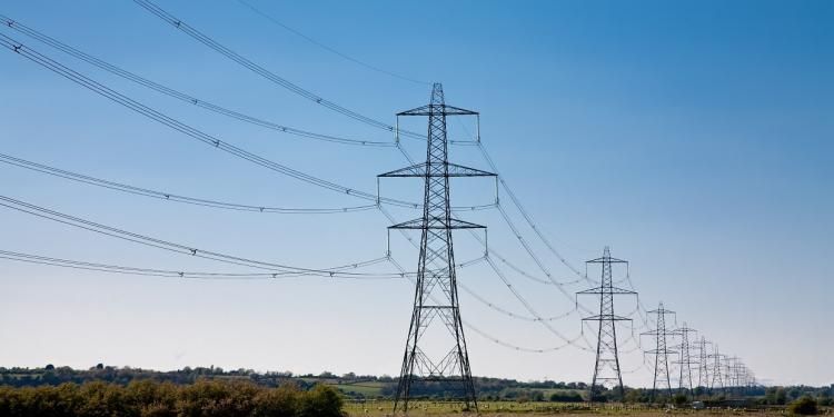 Pylons in countryside and sunshine - Ofgem